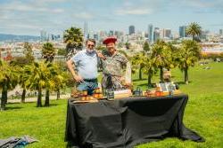 Chaga Owner and SCORE Mentor behind a table